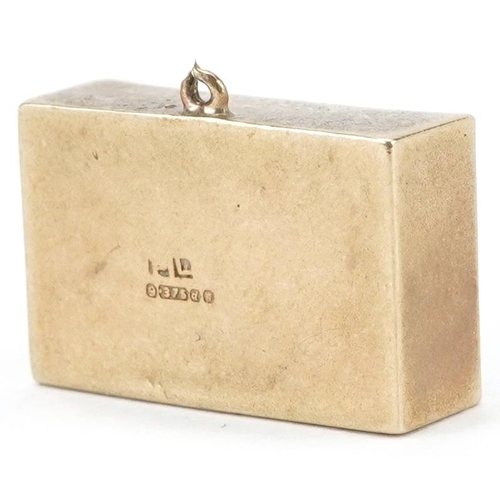 2153 - 9ct gold emergency one pound note charm, 1.9cm wide, 3.0g