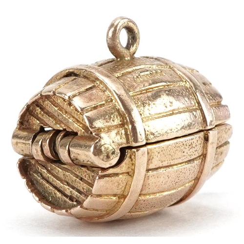 2060 - 9ct gold charm in the form of a beer barrel opening to reveal two hinged elephants, 1.9cm wide, 6.8g