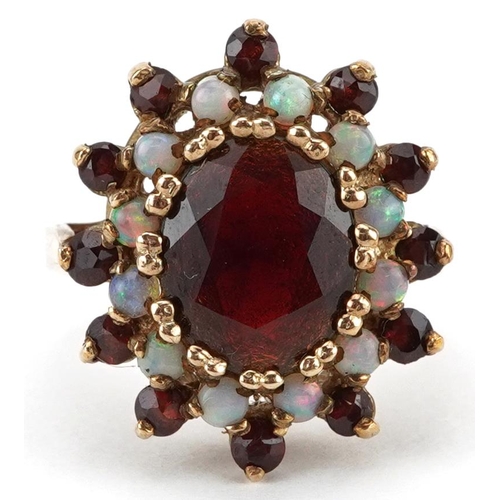 2650 - 9ct gold garnet and opal three tier cluster ring, size L, 6.6g