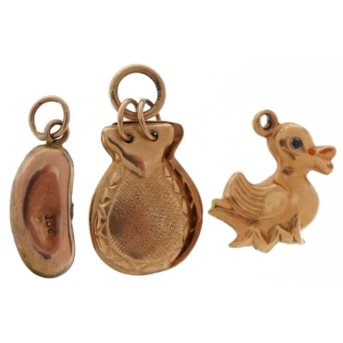 2570 - Three gold charms comprising 9ct rose gold kidney bean, unmarked gold maracas and an unmarked gold a... 