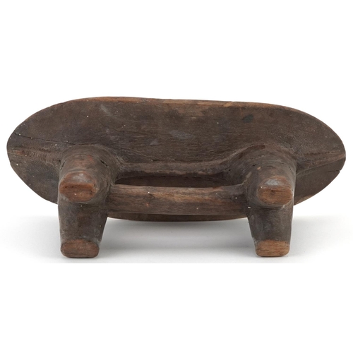  African tribal interest carved hardwood headrest, 30cm wide