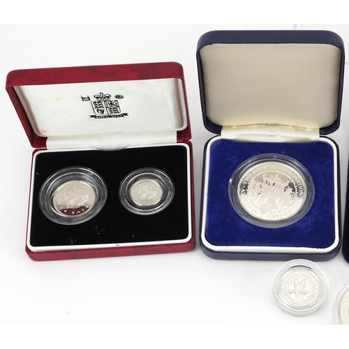 1665 - Nine silver proof coins, some with cases, including 1990 silver proof five pence two coins set, two ... 