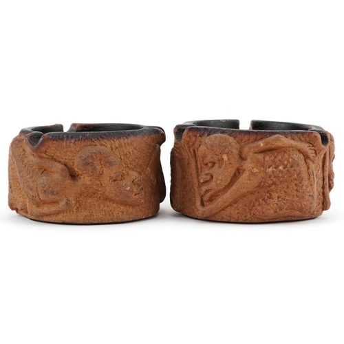 520 - Matched pair of smoking interest Meerschaum ashtrays decorated in relief with figures, each 10cm in ... 