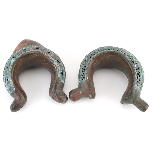 70 - Two West African tribal interest verdigris copper open cuffs, the largest 17.5cm high