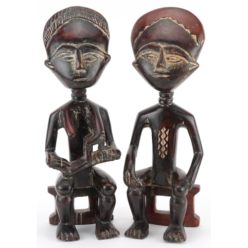 66 - Pair of African tribal interest carved hardwood fertility figures, possibly from Ghana, 32.5cm high