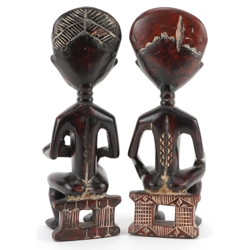 66 - Pair of African tribal interest carved hardwood fertility figures, possibly from Ghana, 32.5cm high