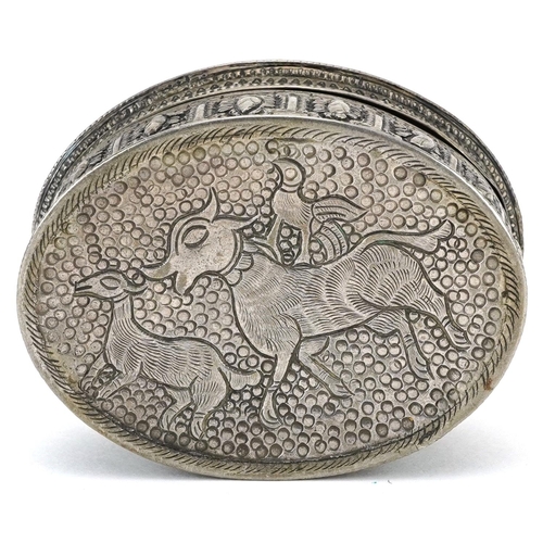 201 - Anglo Indian white metal box and cover profusely embossed and engraved with wild animals and foliage... 