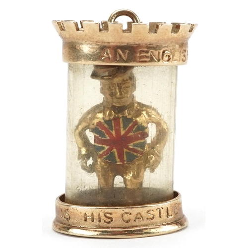 2451 - 9ct gold and enamel charm in the form of man in a castle, engraved An Englishman's Home is his Castl... 