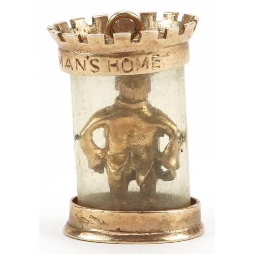 2451 - 9ct gold and enamel charm in the form of man in a castle, engraved An Englishman's Home is his Castl... 