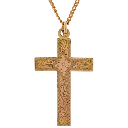 2495 - 9ct gold floral engraved cross pendant on a yellow metal necklace, 3cm high and 42cm in length, the ... 