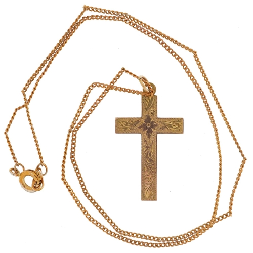 2495 - 9ct gold floral engraved cross pendant on a yellow metal necklace, 3cm high and 42cm in length, the ... 