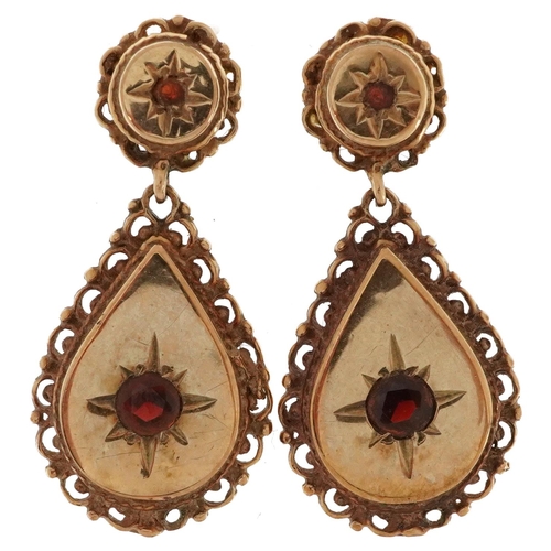 2626 - Pair of Victorian style garnet drop earrings with pierced floral borders, 3cm high, 5.5g