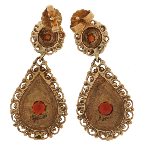 2626 - Pair of Victorian style garnet drop earrings with pierced floral borders, 3cm high, 5.5g