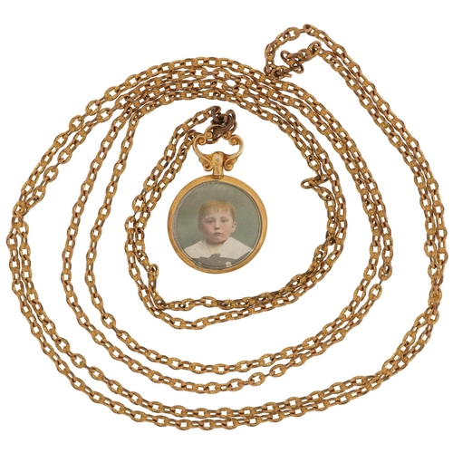 2244 - 9ct gold circular open locket on a yellow metal Longuard chain, 3.5cm high and 130cm in length, tota... 