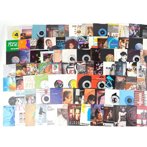 1237 - 45rpm records arranged in three cases including Eric Clapton, Phil Collins, The Stranglers and Tina ... 