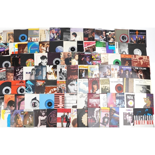 1237 - 45rpm records arranged in three cases including Eric Clapton, Phil Collins, The Stranglers and Tina ... 