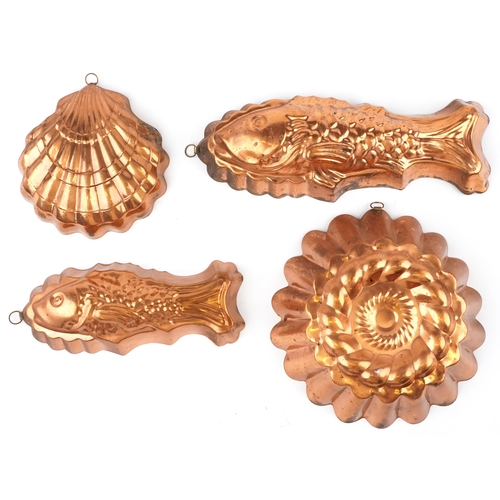 1515 - Four vintage coppered jelly moulds including two in the form of fish, the largest 42cm in length