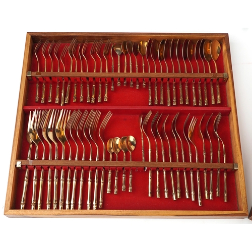 1133 - Thai twelve place canteen of brass cutlery with simulated bamboo handles housed in a hardwood cantee... 