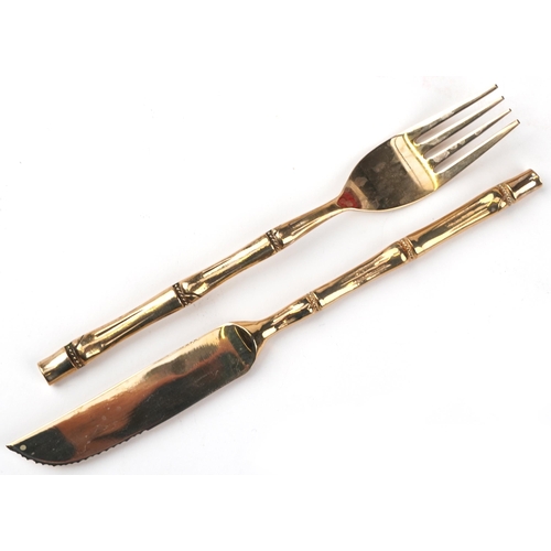 1133 - Thai twelve place canteen of brass cutlery with simulated bamboo handles housed in a hardwood cantee... 