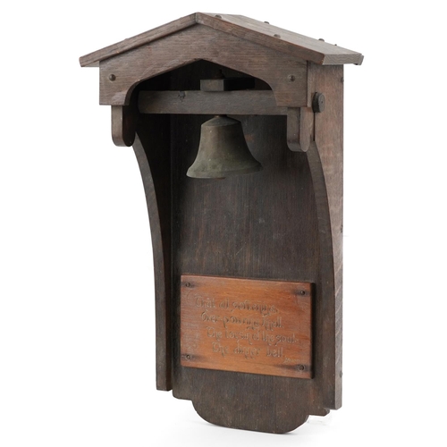 459 - Arts & Crafts oak dinner bell with applied plaque having incised Byron motto, 53cm high