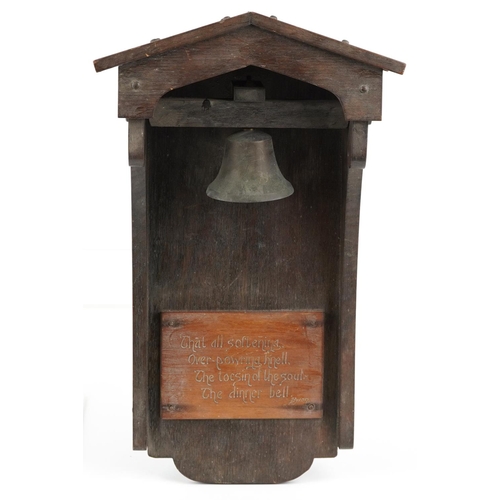 459 - Arts & Crafts oak dinner bell with applied plaque having incised Byron motto, 53cm high