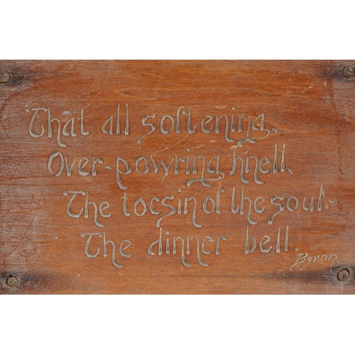 459 - Arts & Crafts oak dinner bell with applied plaque having incised Byron motto, 53cm high