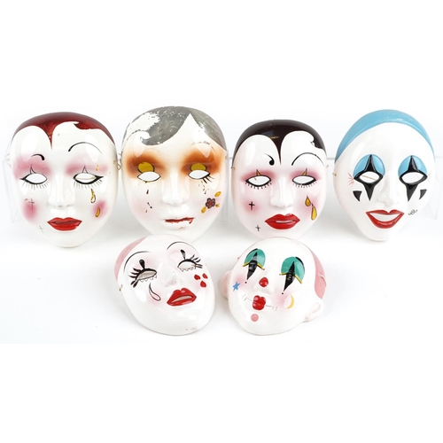 1491 - Five Taiwanese hand painted porcelain face masks, the largest 18cm high