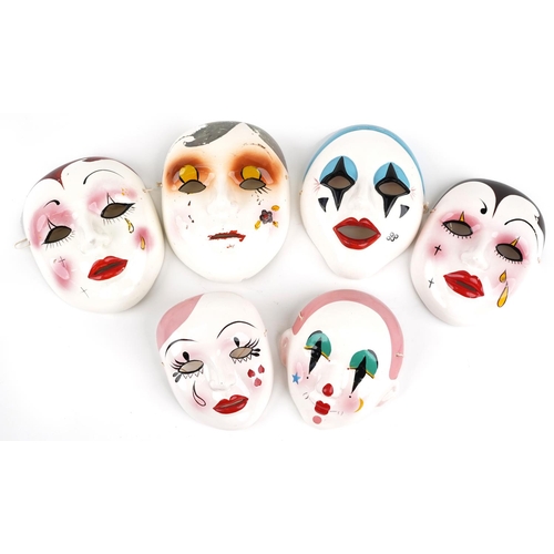 1491 - Five Taiwanese hand painted porcelain face masks, the largest 18cm high