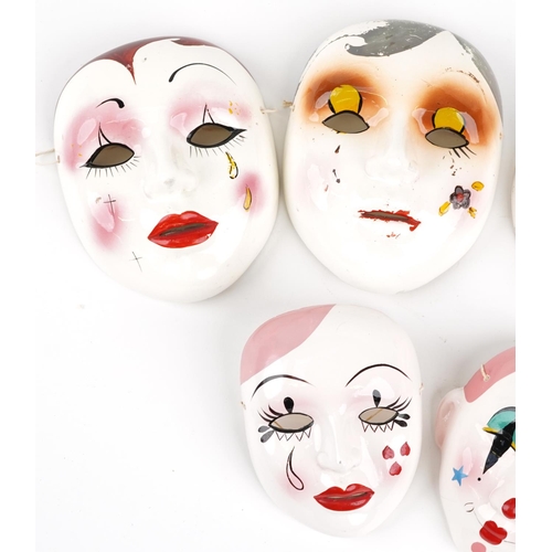 1491 - Five Taiwanese hand painted porcelain face masks, the largest 18cm high