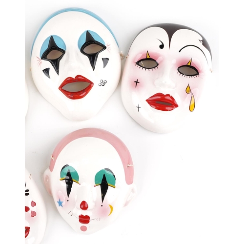 1491 - Five Taiwanese hand painted porcelain face masks, the largest 18cm high