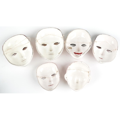 1491 - Five Taiwanese hand painted porcelain face masks, the largest 18cm high