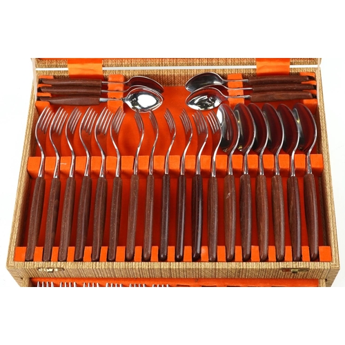 1136 - 1970s Bravingtons six place canteen of stainless steel cutlery with teak handles, the canteen 36.5cm... 