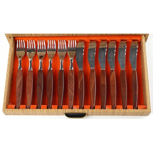 1136 - 1970s Bravingtons six place canteen of stainless steel cutlery with teak handles, the canteen 36.5cm... 