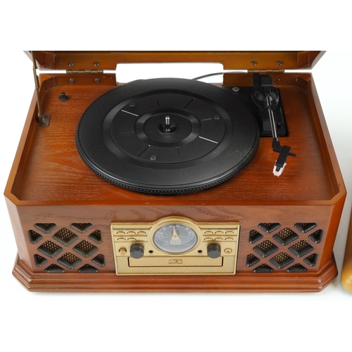 1215 - Two retro wooden record/CD and radio players, the largest, 46cm wide