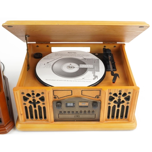 1215 - Two retro wooden record/CD and radio players, the largest, 46cm wide