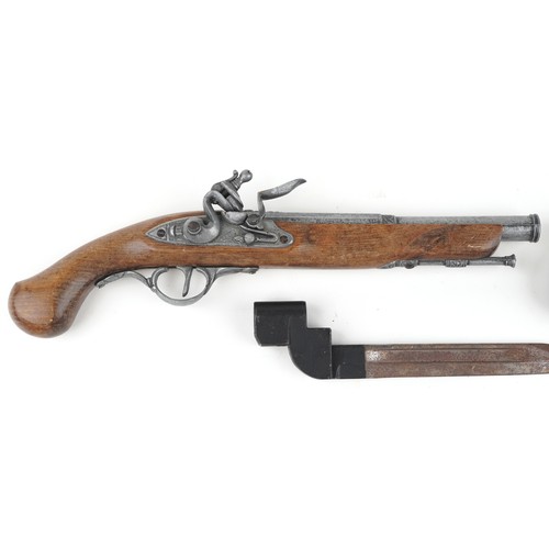 686 - Two decorative model pistols and a bayonet, 38cm in length