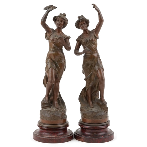 1490 - After Charles Ruchot, pair of classical French patinated spelter statues raised on faux rouge marble... 