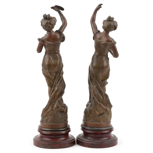 1490 - After Charles Ruchot, pair of classical French patinated spelter statues raised on faux rouge marble... 