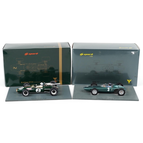 1560 - Two Spark 1:18 scale diecast model racing vehicles with boxes and display stands comprising BRM P57 ... 