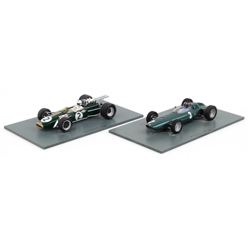 1560 - Two Spark 1:18 scale diecast model racing vehicles with boxes and display stands comprising BRM P57 ... 