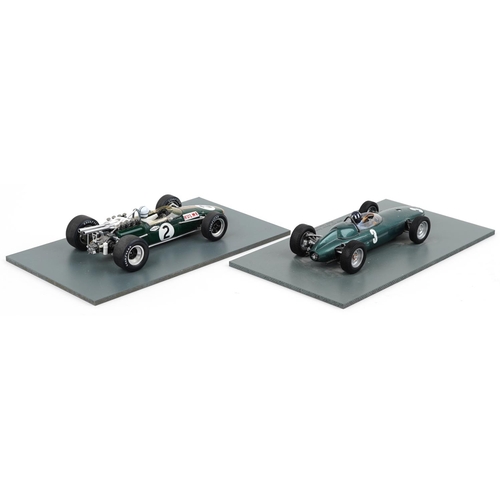 1560 - Two Spark 1:18 scale diecast model racing vehicles with boxes and display stands comprising BRM P57 ... 