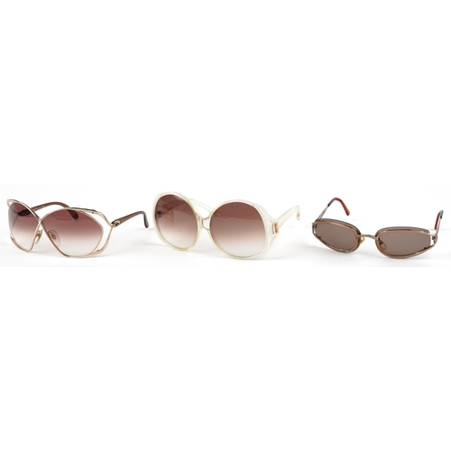 1293 - Three pairs of ladies sunglasses, comprising two Christian Dior, one with case and Yves Saint Lauren... 