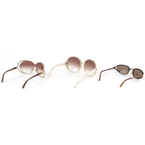 1293 - Three pairs of ladies sunglasses, comprising two Christian Dior, one with case and Yves Saint Lauren... 