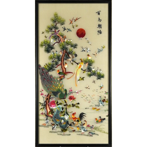 563 - Chinese silk panel embroidered with birds of paradise amongst a tree and a framed doll, the largest ... 