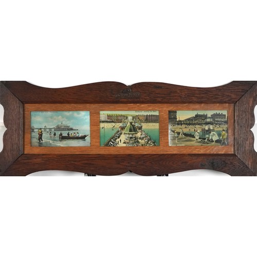 1311 - Pair of Arts & Crafts oak wall frames housing postcards of Eastbourne and surrounding including Term... 