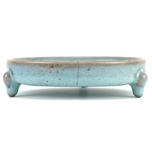 1323 - Chinese porcelain tripod censer having a blue crackle glaze, 14cm in diameter excluding the feet