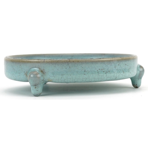 1323 - Chinese porcelain tripod censer having a blue crackle glaze, 14cm in diameter excluding the feet