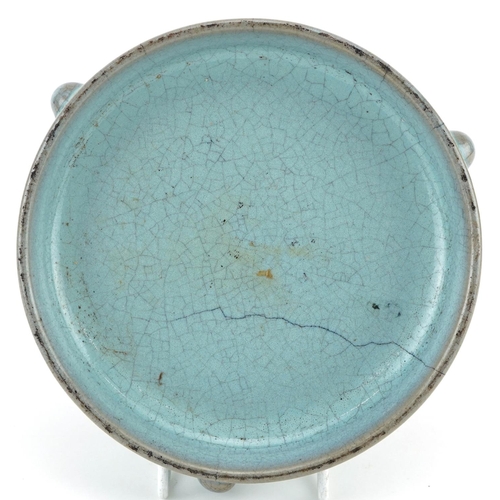 1323 - Chinese porcelain tripod censer having a blue crackle glaze, 14cm in diameter excluding the feet