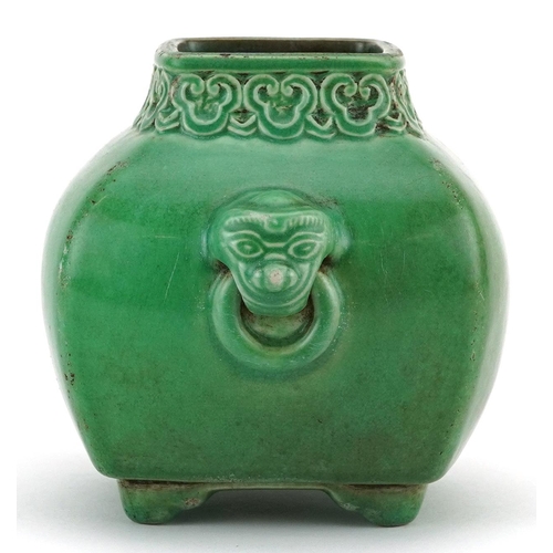 552 - Chinese porcelain green glazed four footed vase with animalia ring turned handles and ruyi head bord... 