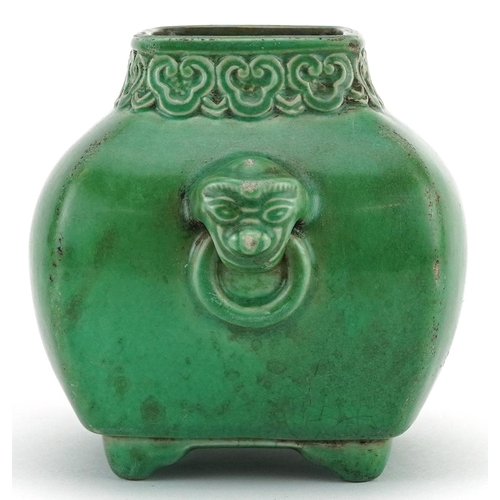 552 - Chinese porcelain green glazed four footed vase with animalia ring turned handles and ruyi head bord... 